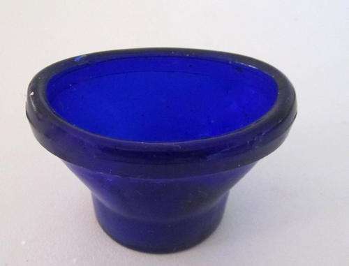 A BLUE GLASS EYE RINSER