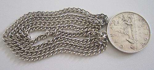 1953 SILVER CANADIAN DOLLAR ON A SILVER CHAIN(55,5gram)23,32gram,800  and 32,18gram,925 respectively