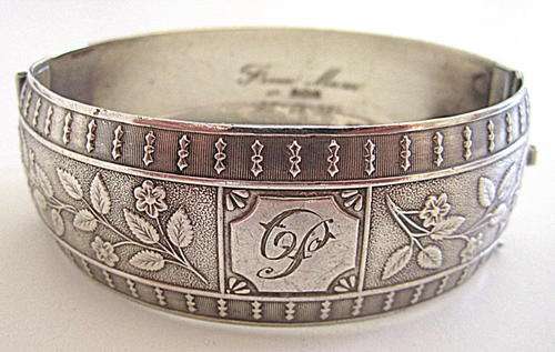 A HALLMARKED SILVER ART NOUVEAU BANGLE----WEIGHT 37,7 GRAM--NOTE ENGRAVED
