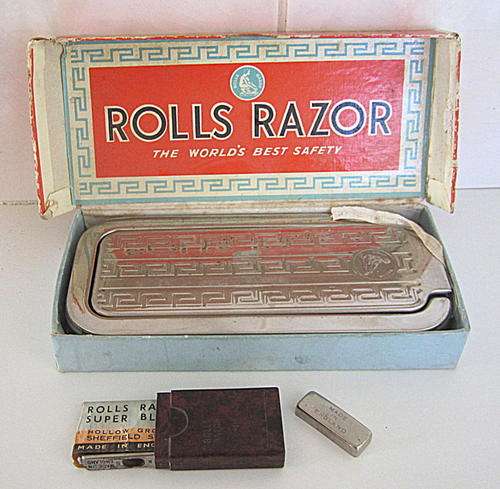 A ROLLS RAZOR IN ORIGINAL BOX AND CONTAINER