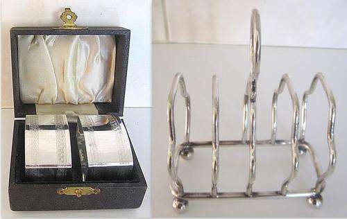 A SET OF SILVER PLATED (E.P.N.S.) SERVIETTE RINGS BOXED AND A SILVER PLATED TOAST RACK--NOTE