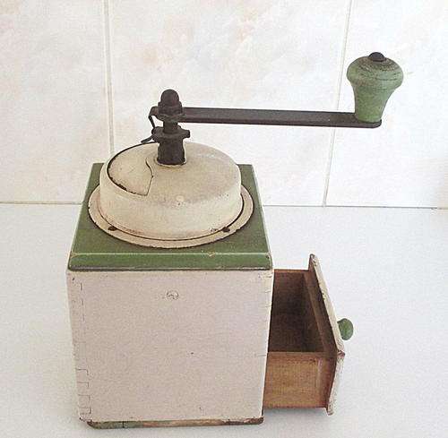 A VINTAGE  METAL AND WOODEN GRINDER PROBABLY USED FOR COFFEE