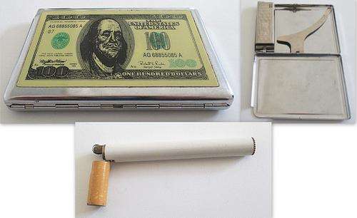 A CIGARETTE CASE / LIGHTER COMBO AND A LIGHTER IN THE FORM AND SIZE OF A CIGARETTE