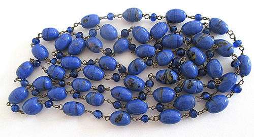 A VINTAGE GLASS FLAPPER  NECKLACE