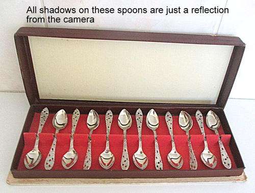 A SET OF 12 BOXED DUTCH COFFEE SIZED SPOONS--CUTE