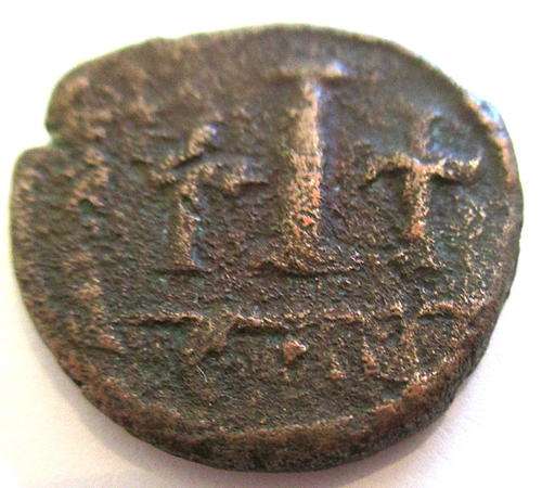 AN ANCIENT COIN  JUSTINIA IN NUMIDIA--ROUND 575 AD --Over 1400 years old