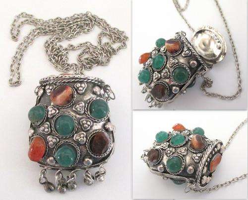 A PERFUME CONTAINER ON A LONG CHAIN WITH SEMI-PRECIOUS STONES