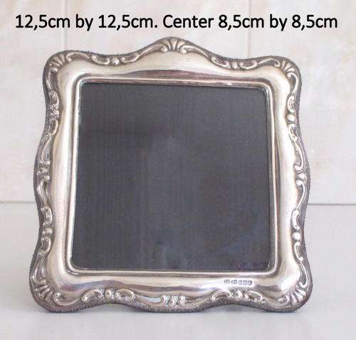 A HALLMARKED SILVER PHOTO FRAME