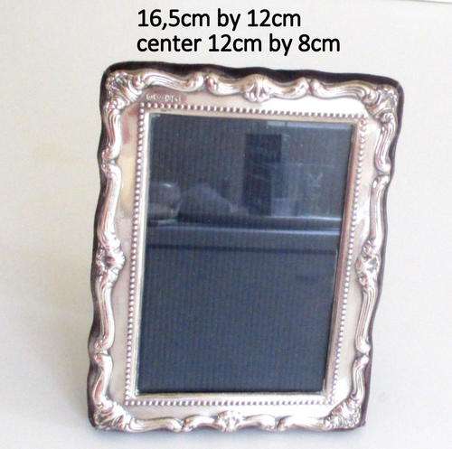 A HALLMARKED SILVER PHOTO FRAME