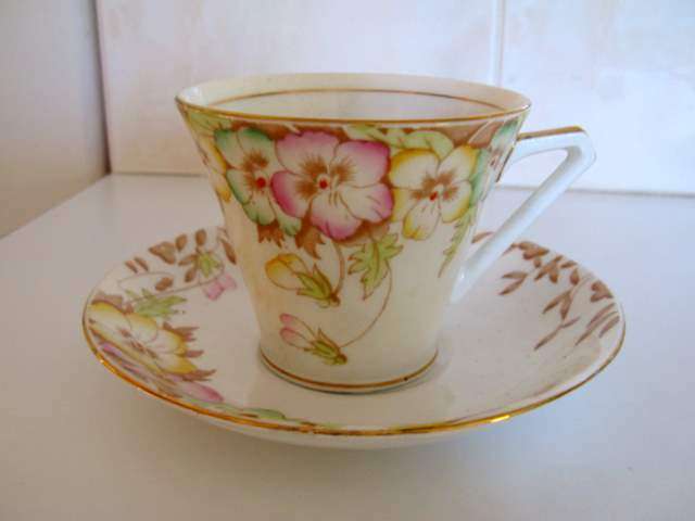 A BELL CHINA CAP AND SAUCER