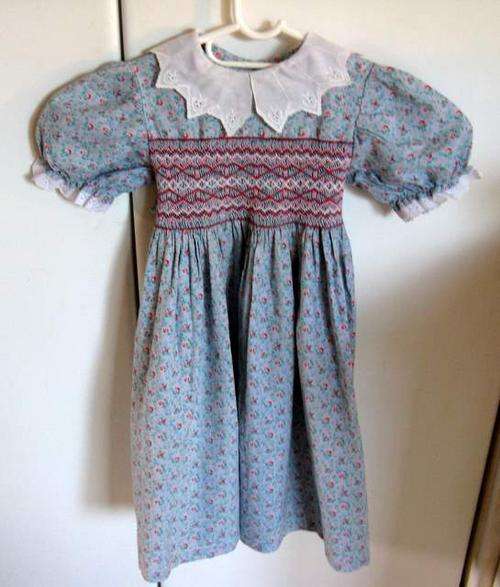 A CHILDS 20 YEAR OLD SMOCKED DRESS---HOME SEWN