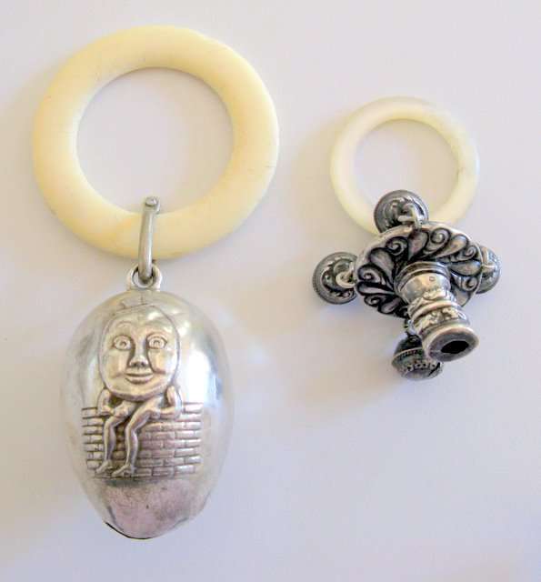 A HALLMARKED RATTLE WITH TEETHING RING---HANDLE MISSING--ALONG WITH AN E.P.N.S. RATTLE