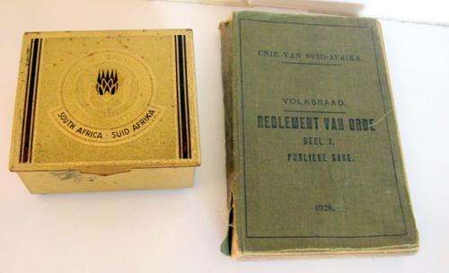 AN EMPIRE EXHIBITION CIGAR BOX 1936 AND AN AFRICANS BOOK ON THE  REGULATIONS IN PARLIMENT DATED 1928