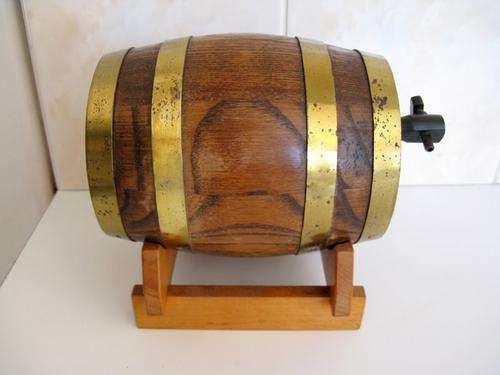 AN OAK AND BRASS BARREL--PLEASE NOTE