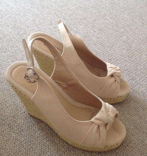 Cream pretty wedges used twice size 3