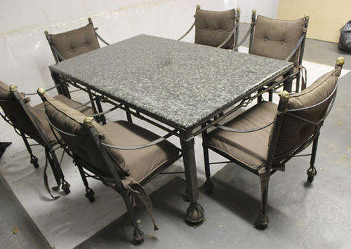 Wrought Iron Table with Granite Top and Six Wrought Iron Chairs with Brass Lion Head Finials