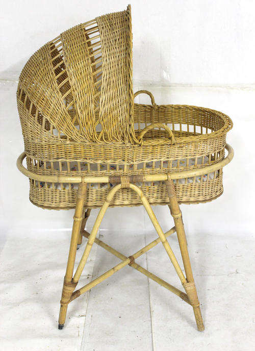 Vintage wicker cot with castors on 2 legs