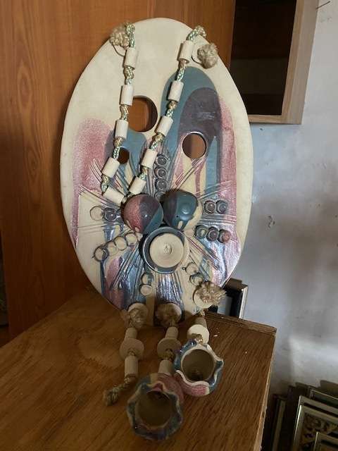 Decorative hanging pottery plaque with bells