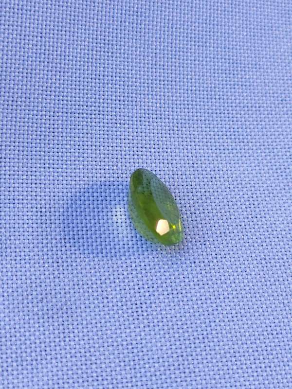 Peridot: - 10 x 8 x 5.25 mm natural mined oval cut stone - 3.02 ct
