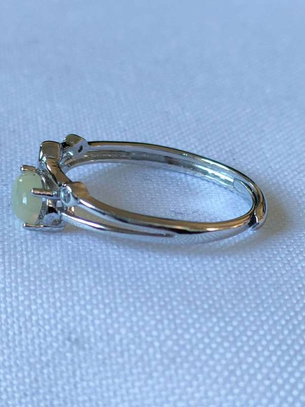 Sterling Ethiopian Opal and White Topaz ring: Size: Adjustable Weight: 0.80.ct+
