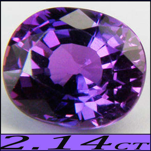2.14 CT WONDERFULLY LUSTROUS DEEP PURPLE SAPPHIRE GEMSTONE POLISHED IN A MODERN OVAL.