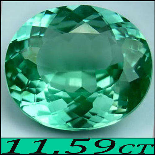 11.95 CT LOVELY BRIGHT LIME GREEN NATURAL PRASIOLITE, A MODERN BRILLIANT MULTI FACETED OVAL GEM.