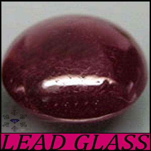 5.64 CARAT NATURAL SCARLET DEEP PURPLISH RED RUBY GEMSTONE, A CABOCHON OVAL FROM TANZANIA.