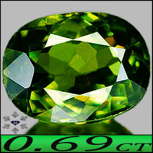 0.69 CT IMMENSELY LUSTROUS NATURAL DEMANTOID GARNET, AN INTENSE GREEN OVAL GEMSTONE.