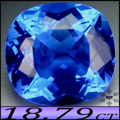 18.79CT TANZANITE BLUE COLOURED QUARTZ CUSHION, A MAGNIFICENT MULTI FACETED ENHANCED GEMSTONE.