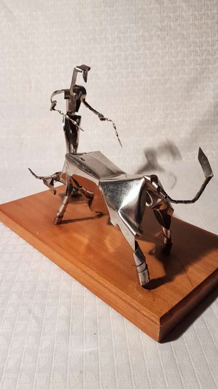 Two stunning metal art items (Wizard of Oz Tin Man and Matador and Bull)