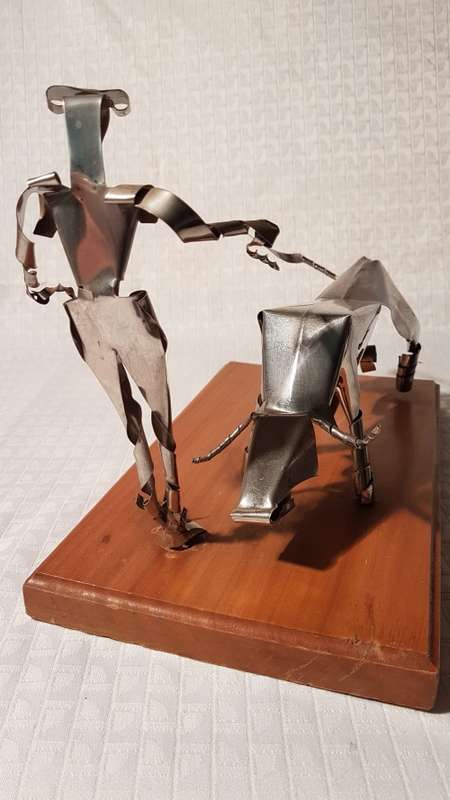 Two stunning metal art items (Wizard of Oz Tin Man and Matador and Bull)