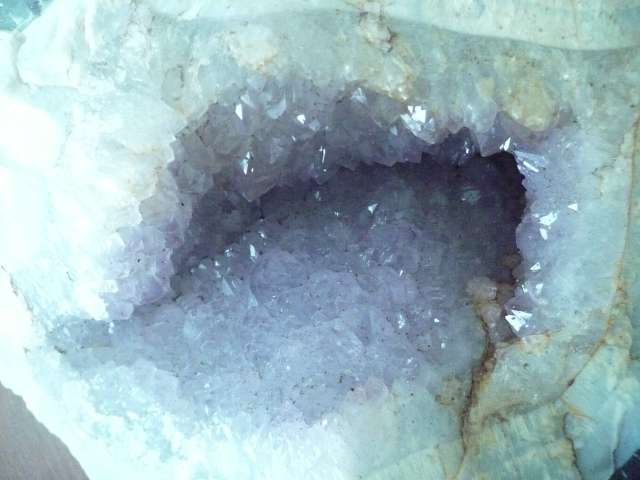 LARGE AMETHYST GEODE  IN A BED OF QUARTZ