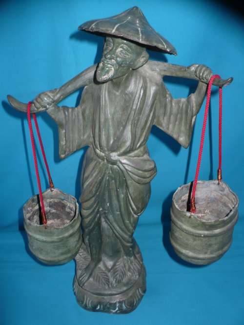 BRONZED FIGURE OF A CHINESE WATER CARRIER