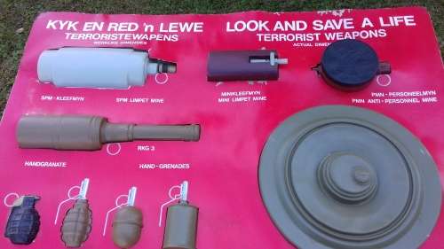 1980's  TERRORIST WEAPONS DISPLAY BOARD    (CARDBOARD WITH PLASTIC