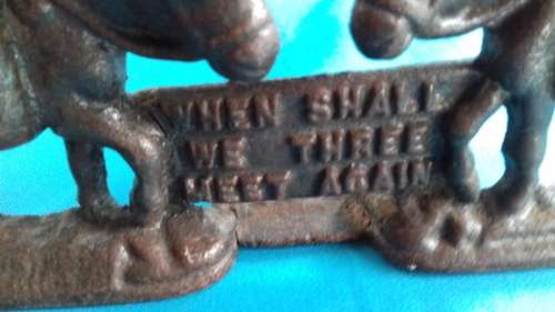 PAIR OF MULES    CAST IRON DOOR STOPPER
