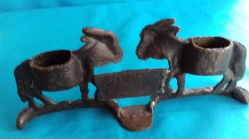 PAIR OF MULES    CAST IRON DOOR STOPPER
