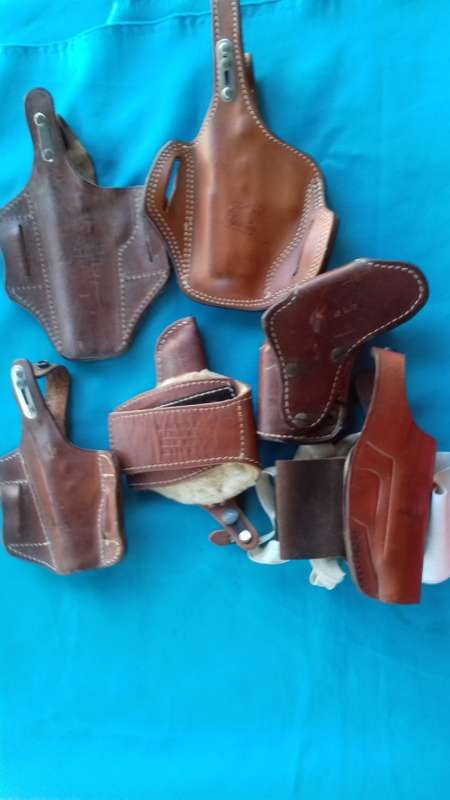 LEATHER HOLSTERS +CARTRIDGE POUCHES