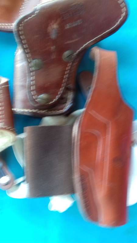 LEATHER HOLSTERS +CARTRIDGE POUCHES
