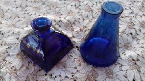 2 BLUE GLASS BOTTLES