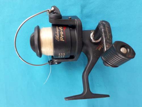 "SHAKESPEARE "    'PRO -AM  140'  FISHING REEL WITH LINE