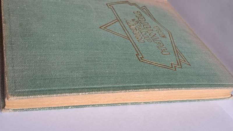 `The Triumph Stamp Album` -  empty (no stamps) - +/- 23cm x 19cm