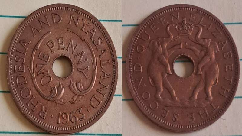 1963 - Rhodesia and Nyasaland  - One Penny - AU/NC- Two elephants stand on hind legs -  Demonetised