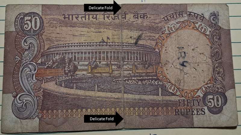 1975-1982 -  India - 50 Rupees - 7QL 594805 -  Note: Delicate Fold and damage