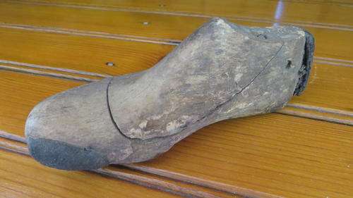 VERY OLD CHILDS SHOE MOULD MADE FROM WOOD AND LEATHER STRIPS.