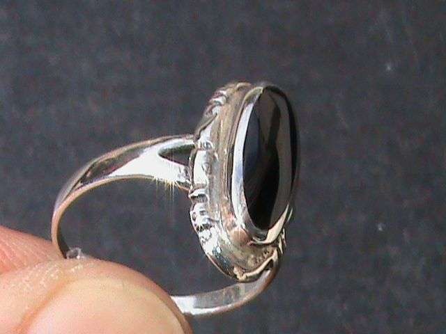 SOLID STERLING SILVER RING WITH OVAL SHAPED BLACK STONE... SIZE N...