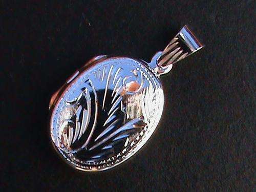 STERLING SILVER LOCKET.....