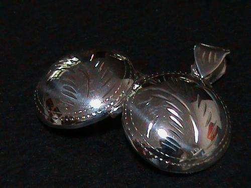 SOLID STERLING SILVER ROUND LOCKET PENDANT....