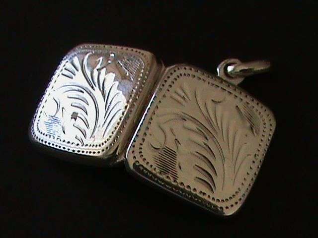 SOLID STERLING SILVER LOCKET...