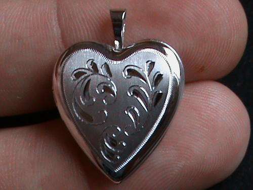 SOLID STERLING SILVER HEART SHAPE LOCKET. EXCELLENT QUALITY AND DETAIL.