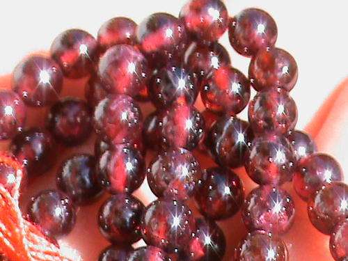 GARNET GEMSTONE BEADS.  + - 4.3  MM ROUND .  PRICE PER STRING